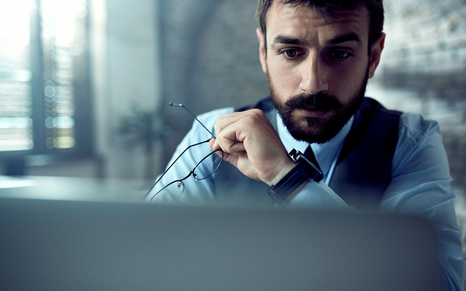 Man holding glasses.